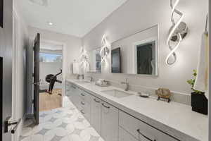 Bathroom featuring hardwood / wood-style flooring and vanity