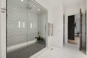 Bathroom featuring a tile shower and tile patterned floors