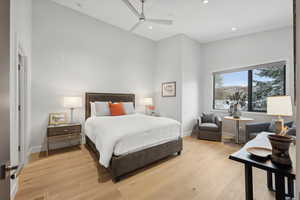 Bedroom with ceiling fan and light wood-type flooring