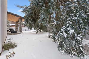 View of yard layered in snow