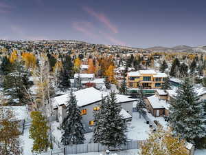 Snowy aerial view featuring a mountain view