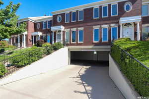 Townhome / multi-family property featuring a garage