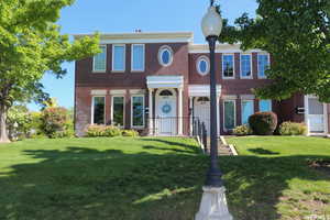 View of front of house featuring a front lawn