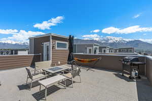 View of patio with a mountain view and grilling area