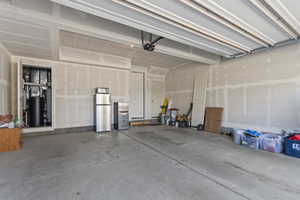 Garage featuring stainless steel fridge