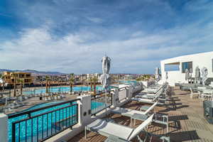 View of pool with a water and mountain view