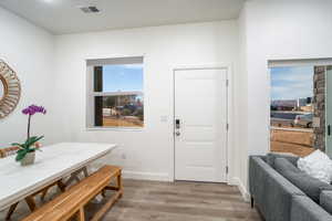 Entryway with light hardwood / wood-style floors