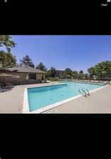 View of swimming pool with a patio area