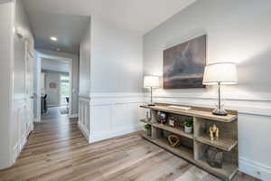 Corridor featuring light hardwood / wood-style flooring