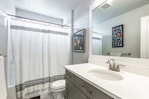 Bathroom with vanity and toilet