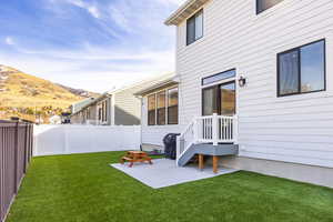 View of yard with a mountain view and a patio