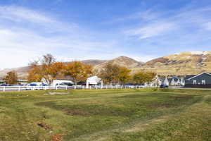 View of yard with a mountain view and a rural view