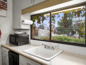 Kitchen featuring natural light over sink.