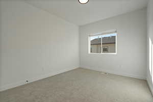 View of carpeted spare room