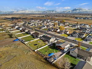 Birds eye view of property with a mountain view