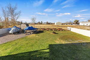 View of yard featuring a storage unit