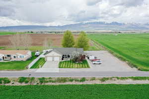 Birds eye view of property with a mountain view and a rural view