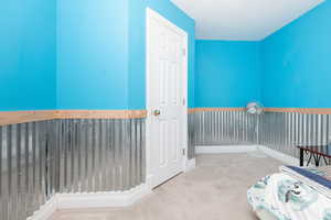 Unfurnished bedroom featuring light colored carpet