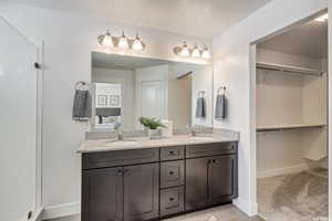 Bathroom featuring tile patterned flooring and vanity