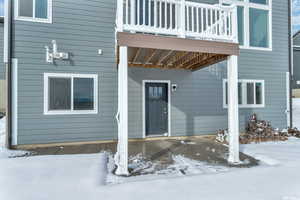 View of snow covered property entrance