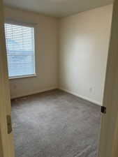 Unfurnished room featuring carpet floors