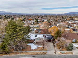 Birds eye view of property with a mountain view