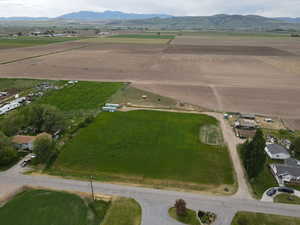 Drone / aerial view featuring a mountain view and a rural view