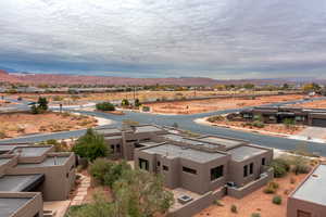 Birds eye view of property featuring a mountain view