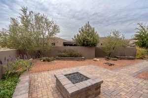 View of patio / terrace with an outdoor fire pit