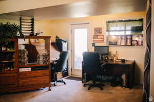 Office with plenty of natural light and carpet floors