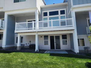 Back of house featuring a yard, a patio, and central AC unit