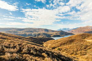 Property view of mountains featuring a water view