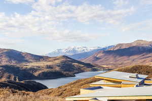 Property view of mountains with a water view