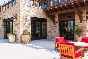 Property entrance with french doors and a patio