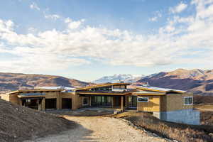 View of front facade featuring a mountain view and a patio