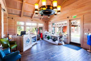 Reception area featuring french doors and an inviting chandelier