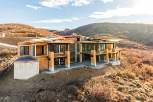 View of front facade featuring a patio area and a mountain view