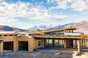 Exterior space featuring a mountain view and a patio