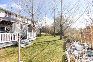 View of yard featuring a deck