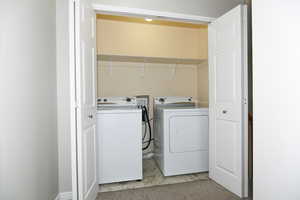 Washroom with washing machine and dryer