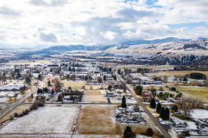 Birds eye view of property with a mountain view