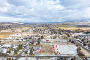 Birds eye view of property with a mountain view