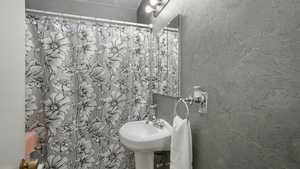 Bathroom featuring walk in shower