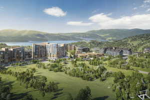 Birds eye view of property with a water and mountain view