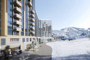 Snow covered building with a mountain view