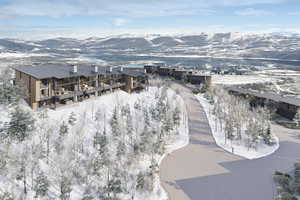 Snowy aerial view featuring a mountain view