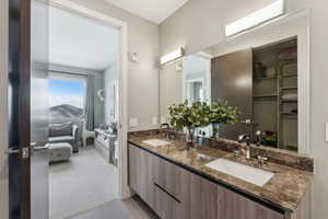 Bathroom with tile patterned flooring and vanity