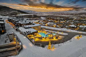 Snowy aerial view featuring a mountain view