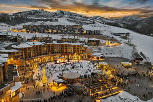 Snowy aerial view featuring a mountain view