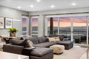 Living room with a mountain view and light wood-type flooring